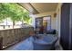 Relaxing covered patio with comfortable seating and view of the wooded area at 40 Gretchen Ct, Oldsmar, FL 34677