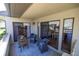 Relaxing covered patio with comfortable seating, and sliders leading to interior dining room at 40 Gretchen Ct, Oldsmar, FL 34677