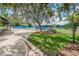 Enjoy a sunny match on the tennis courts, with a covered rest area nearby and lush landscaping at 40 Gretchen Ct, Oldsmar, FL 34677