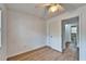 Bright bedroom features wood-look floors and adjoins a clean, simple bathroom at 4414 W El Prado Blvd, Tampa, FL 33629