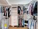 Organized closet with custom shelving, drawers, and ample hanging space for clothing and storage at 4414 W El Prado Blvd, Tampa, FL 33629