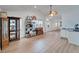 Open dining area with light wood floors, white walls, and natural light from the windows at 4414 W El Prado Blvd, Tampa, FL 33629