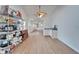 Bright dining area features light wood floors, white walls, and a ceiling fan at 4414 W El Prado Blvd, Tampa, FL 33629