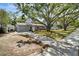 A view of the home showcasing a manicured front yard and lovely curb appeal at 4414 W El Prado Blvd, Tampa, FL 33629