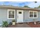 Charming front entryway with a cozy porch and fresh landscaping at 4414 W El Prado Blvd, Tampa, FL 33629