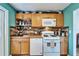 Bright kitchen featuring ample cabinet space, modern appliances, and butcher block countertops at 4414 W El Prado Blvd, Tampa, FL 33629