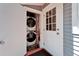 Convenient laundry closet with stacked washer and dryer, easily accessible near the door at 4414 W El Prado Blvd, Tampa, FL 33629