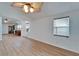 Bright living area with hardwood floors, ceiling fans, recessed lighting, and efficient cooling at 4414 W El Prado Blvd, Tampa, FL 33629