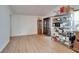 Bright living area with vaulted ceiling and modern floors featuring shelving for storage or display at 4414 W El Prado Blvd, Tampa, FL 33629