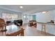 Open-concept living space with bar, dining area and bright natural lighting at 4414 W El Prado Blvd, Tampa, FL 33629