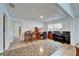 Well-lit office area featuring a piano, desk, and view into the kitchen, and a small dining table at 4414 W El Prado Blvd, Tampa, FL 33629