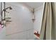 Features a shower with tiled walls, handheld shower head, and a built-in seat at 4414 W El Prado Blvd, Tampa, FL 33629