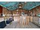 Inside tiki bar with bamboo accents, seating, decorative elements, and a tropical theme for a fun atmosphere at 4414 W El Prado Blvd, Tampa, FL 33629