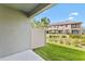 The property's backyard features a well-maintained lawn, partial fencing, and lovely landscaping at 4663 Almada Ln, Wesley Chapel, FL 33543