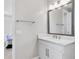 Bathroom vanity with modern fixtures and a large mirror at 4663 Almada Ln, Wesley Chapel, FL 33543