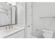 Bathroom vanity with a large mirror at 4663 Almada Ln, Wesley Chapel, FL 33543