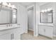 Bright bathroom with double sinks, modern fixtures, and a separate toilet room at 4663 Almada Ln, Wesley Chapel, FL 33543