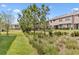 Scenic view of the community grounds, showcasing the green spaces, landscaping, and building exteriors at 4663 Almada Ln, Wesley Chapel, FL 33543
