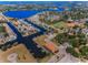 Expansive aerial view showcasing waterfront properties, a golf course, and a baseball field at 47 W Morgan St, Tarpon Springs, FL 34689