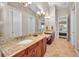 Bathroom boasts dual sink vanity with granite counters and lake views at 47 W Morgan St, Tarpon Springs, FL 34689
