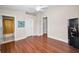 Bedroom with hardwood floors, white trim and neutral walls at 47 W Morgan St, Tarpon Springs, FL 34689