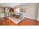 Charming dining area with hardwood floors, a decorative chandelier and a view to the living area at 47 W Morgan St, Tarpon Springs, FL 34689