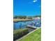 Community dock view featuring boat lifts; convenient for boating enthusiasts in a serene waterfront setting at 47 W Morgan St, Tarpon Springs, FL 34689