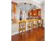 Kitchen bar features granite countertops, wooden cabinets, pendant lighting, and seating for four at 47 W Morgan St, Tarpon Springs, FL 34689