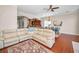 Open concept living area with hardwood floors, access to kitchen and dining area, and comfortable seating at 47 W Morgan St, Tarpon Springs, FL 34689