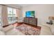 Bright living room with hardwood floors, balcony, view of lake, and modern decor at 47 W Morgan St, Tarpon Springs, FL 34689
