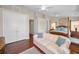 This primary bedroom features hardwood floors, two ceiling fans and two entrances at 47 W Morgan St, Tarpon Springs, FL 34689