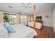 Bright main bedroom features wood floors, sitting area, and balcony access at 47 W Morgan St, Tarpon Springs, FL 34689