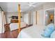 Bright main bedroom features wood floors, sitting area, and ensuite bathroom at 47 W Morgan St, Tarpon Springs, FL 34689