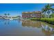Waterfront building featuring multiple balconies and boat docks with a picturesque waterfront view at 47 W Morgan St, Tarpon Springs, FL 34689
