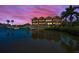 Picturesque waterfront views featuring multi-story residences, private docks, and stunning sunset skies at 47 W Morgan St, Tarpon Springs, FL 34689