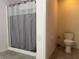 Bathroom with shower stall and toilet at 4908 Babbling Brook Ln, Wimauma, FL 33598