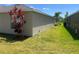 Exterior view of a home and lawn at 4908 Babbling Brook Ln, Wimauma, FL 33598