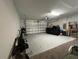 Spacious two car garage with an automatic door and plenty of space for storage at 4908 Babbling Brook Ln, Wimauma, FL 33598