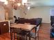 Open-concept living area offers a spacious dining area connected to a cozy living room space at 4908 Babbling Brook Ln, Wimauma, FL 33598