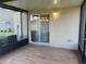 Tiled patio with a sliding glass door at 4908 Babbling Brook Ln, Wimauma, FL 33598