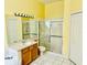 Bright bathroom showcasing modern fixtures, glass enclosed shower, and ample counter space at 4942 Oldham St, Sarasota, FL 34238