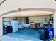 Attached garage with ample storage shelving and space for vehicles and household items at 4942 Oldham St, Sarasota, FL 34238