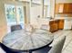 Kitchen open to the dining room with pool view from a bright and airy space at 4942 Oldham St, Sarasota, FL 34238