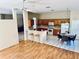 Open kitchen and breakfast nook, featuring wooden cabinets and a breakfast bar with barstool seating at 4942 Oldham St, Sarasota, FL 34238
