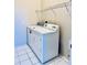 Convenient laundry area with washer and dryer hookups and storage shelving at 4942 Oldham St, Sarasota, FL 34238