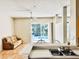 Light filled Living Room with view to Pool and large sliding glass doors at 4942 Oldham St, Sarasota, FL 34238