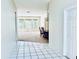 A view into the living room with light walls, and large windows at 4942 Oldham St, Sarasota, FL 34238