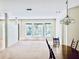 Bright living room with three large windows and a view out to the pool area at 4942 Oldham St, Sarasota, FL 34238