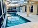 Inviting screened-in pool with ample deck space, perfect for relaxation and entertaining at 4942 Oldham St, Sarasota, FL 34238