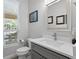 Bathroom with a modern vanity, white countertop, and a framed mirror at 5004 Waterkey Way, Tampa, FL 33647